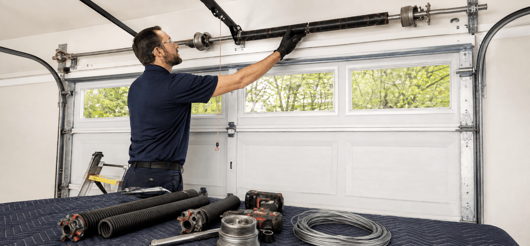 Garage door spring system inspection and evaluation